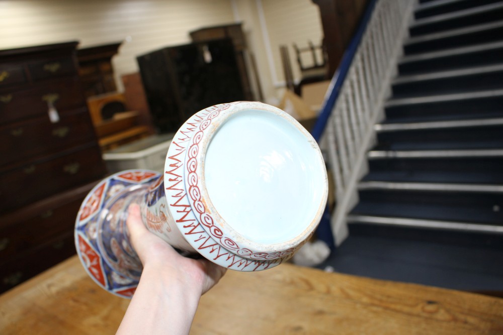 A near pair of Imari trumpet vases, decorated with birds and flowers, height 39.5cm